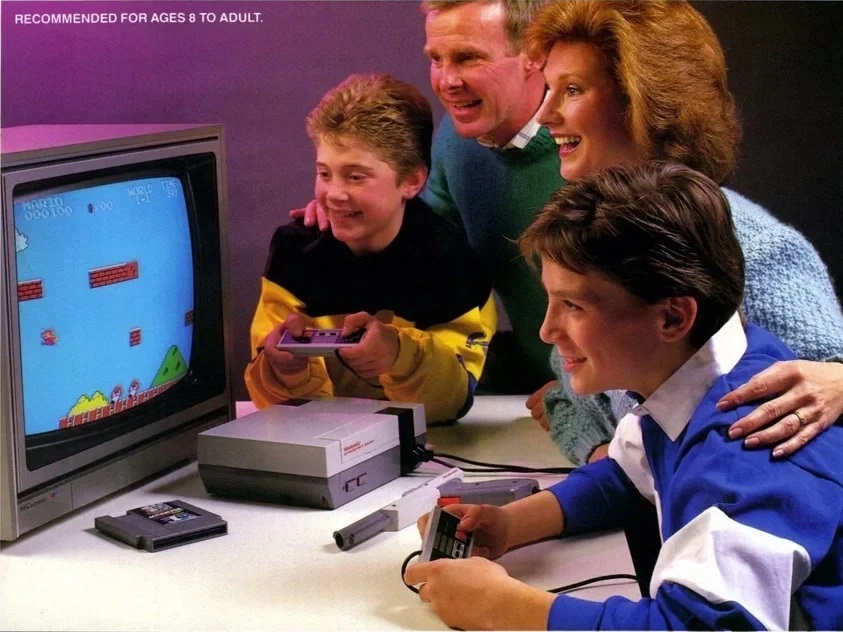 A family having fun playing the Nintendo Entertainment System